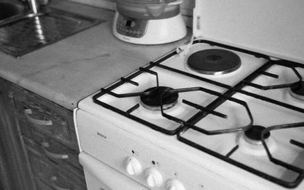 A landlord reviewing rental agreement and insurance documents for small space stove installation