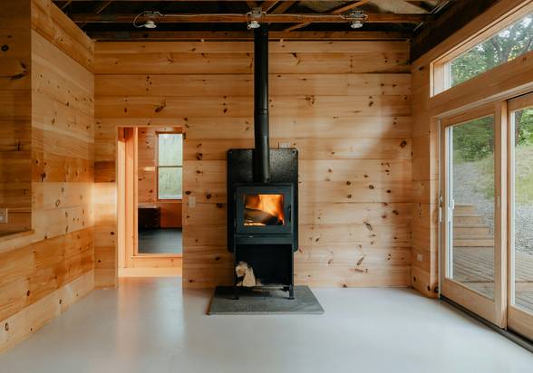 A compact, affordable heating stove in a modest but cozy home interior