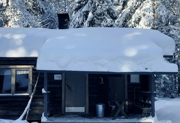 A robust heating stove keeping a snowy mountain cabin warm in a cold climate
