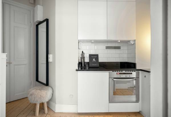 A compact heating stove operating in a cozy small apartment or tiny house