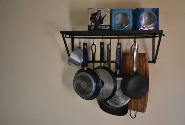 A collection of essential stove accessories: tool set, hearth pad, thermometer, fan, ash bucket