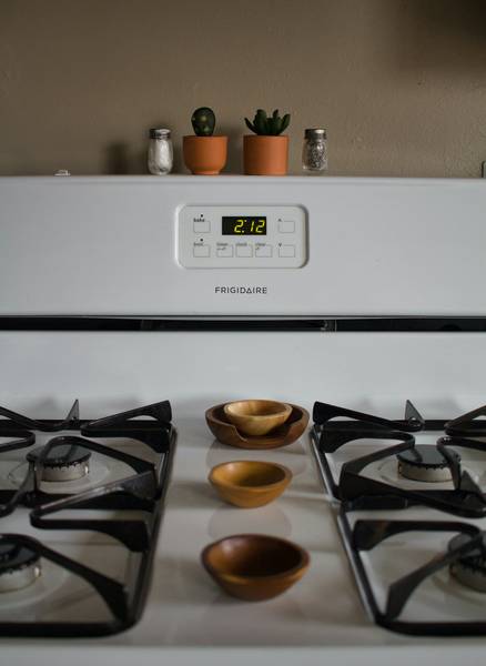 A lineup of different types of heating stoves for comparison