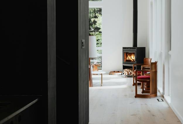 A modern electric stove providing cozy warmth in a contemporary living room