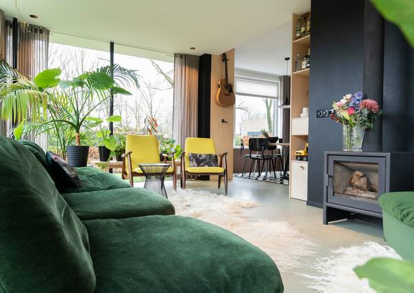 A selection of modern heating stoves in a bright, cozy living space