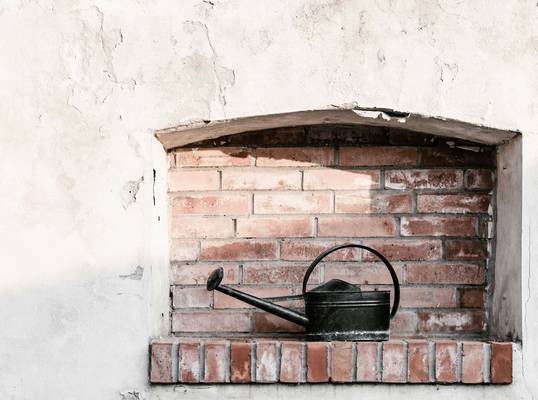 Pellet stove being installed with direct venting through an exterior wall